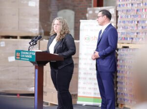 Julie McCabe stands with Gov. Josh Shapiro